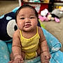 Linoa Grace joined the competition — help win amazing prizes! baby, child, yellow_onesie, blue_chair, smile, holding_hand, indoor, toys, carpet, face, person, cute, chubby_cheeks, happy, infant, sitting, soft_focus, background_blur, home, playtime