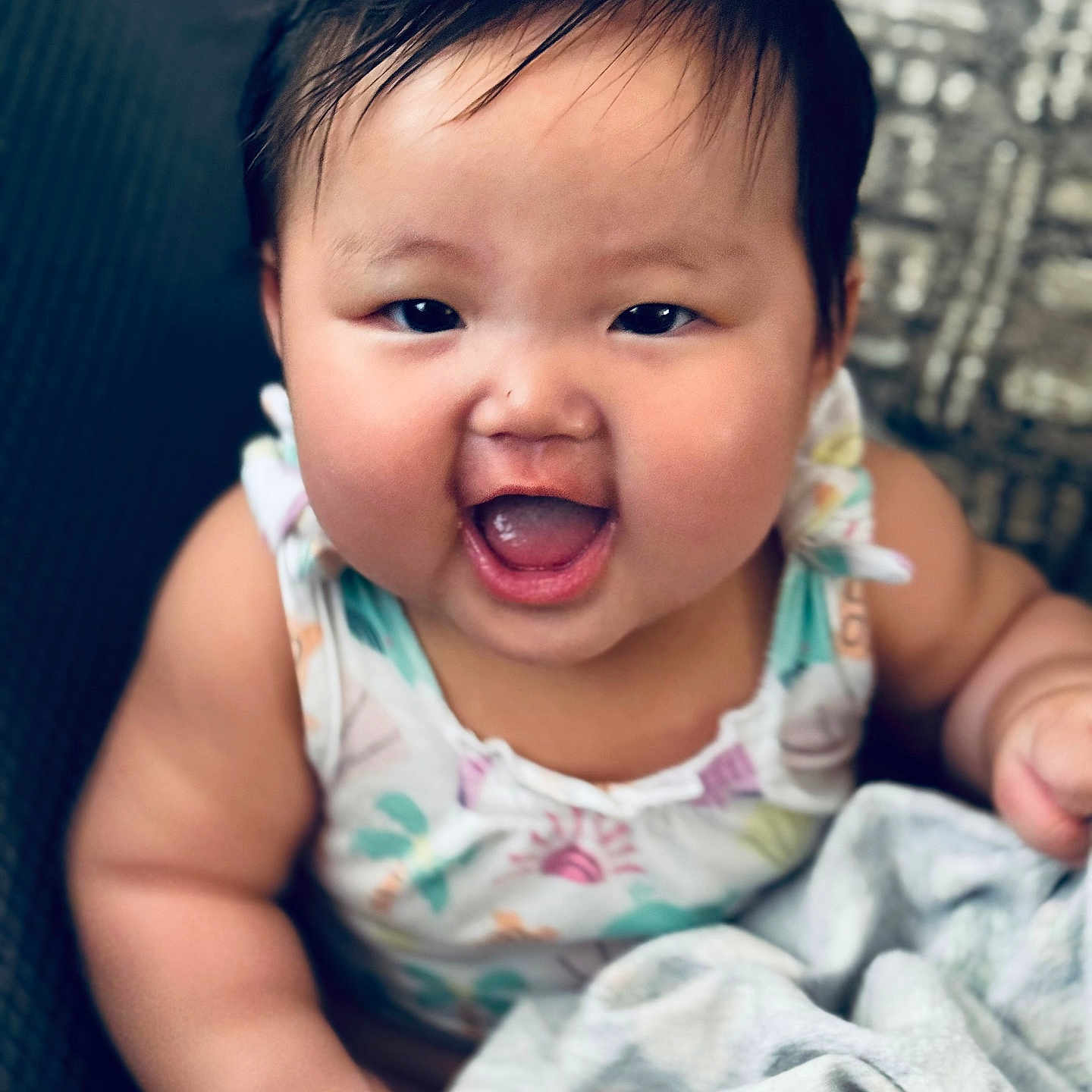 Linoa Grace joined the competition — help win amazing prizes! baby, blanket, cheeks, child, clothing, colorful, cute, expression, face, hair, happy, head, indoors, infant, person, portrait, sitting, skin, smiling, young