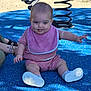 Isadora participe au concours pour gagner de l'argent avec cette photo : baby, child, playground, spring_toy, blue_surface, pink_clothing, bib, tongue_out, sitting, outdoor, person, hand, shoe, fun, cute, support, sunlight, shadow, expression, playtime