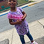 Asiyah Sareal joined the competition — help win amazing prizes! child, girl, smiling, birthday_sash, unicorn_dress, purple_crocs, hair_bow, sidewalk, street, concrete, residential_area, fence, jeans, outdoor, daylight, happy, pose, person, footwear, casual_clothing