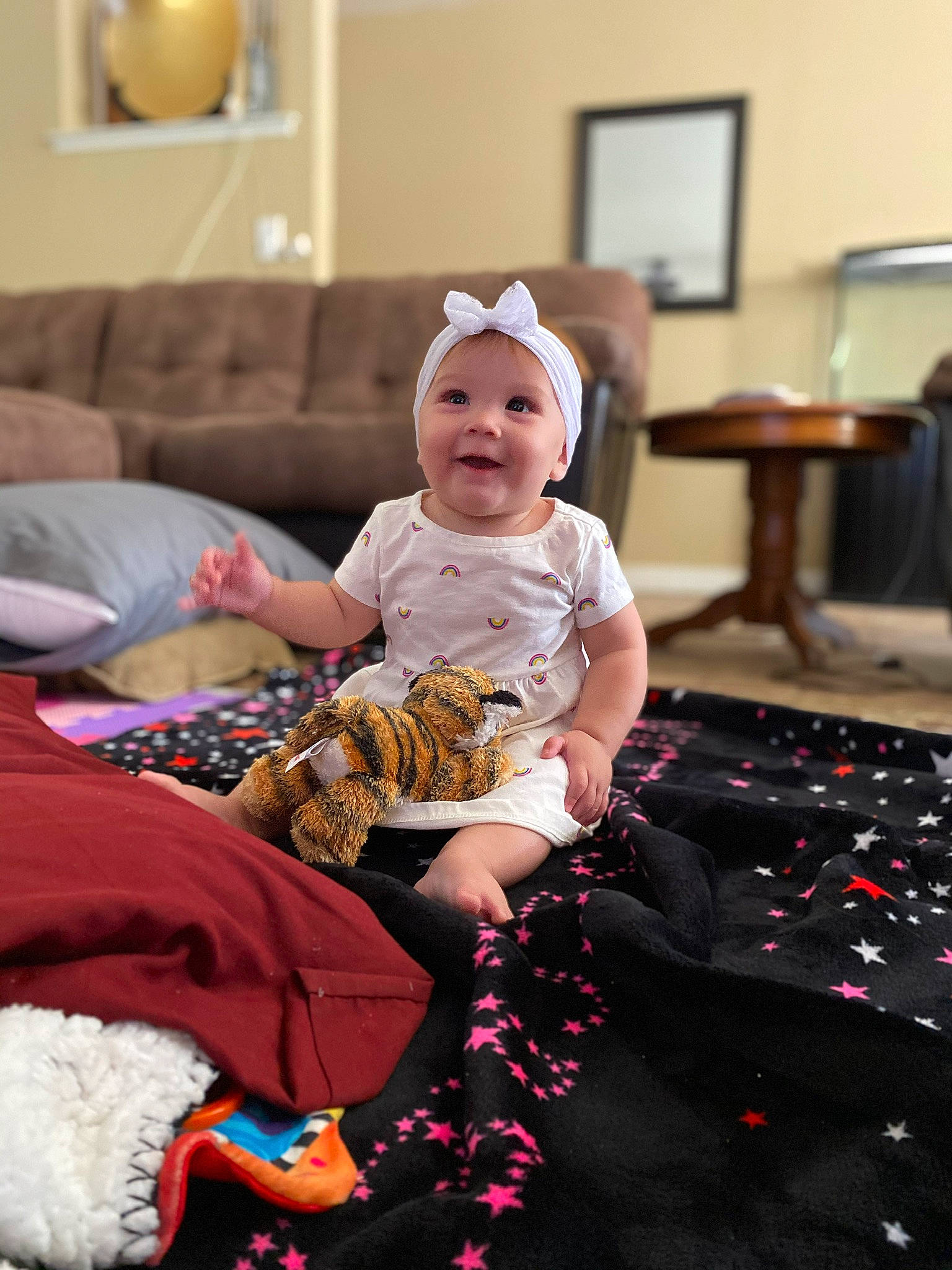 Chloe is registered to the contest to win money with this photo: baby, child, christmas, christmas_eve, family, fun, headwear, joy, people, person, play, room, sitting, skin, toddler