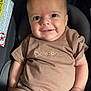 Dawson is registered to the contest to win money with this photo: baby, child, smiling, infant, car_seat, brown_clothing, cute, portrait, indoors, young, person, seat, happy, face, skin, hand, eyes, head, sitting, one_person