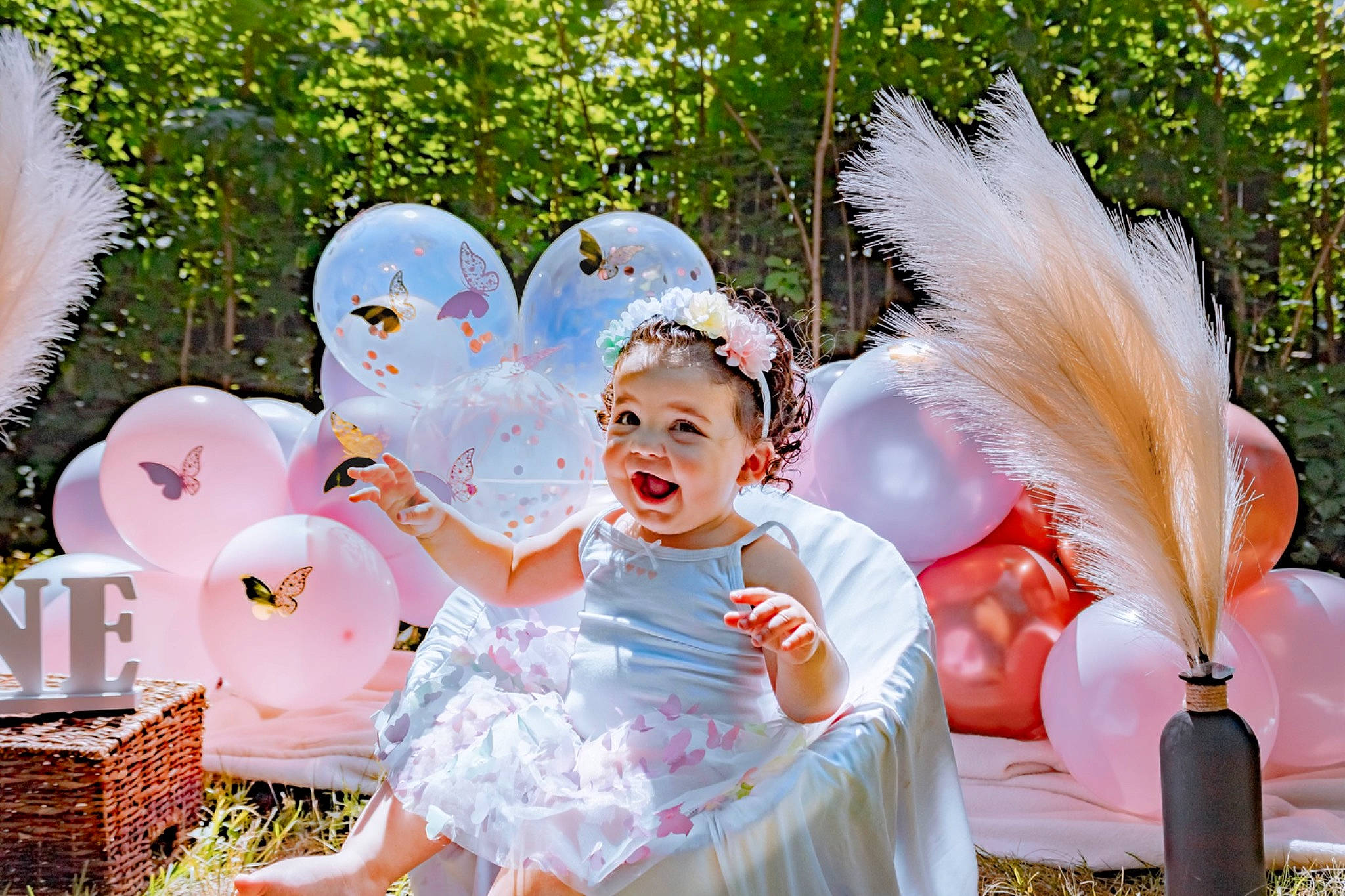 Isabella is registered to the contest to win money with this photo: basket, child, costume, event, fashion_accessory, fictional_character, fun, garden, grass, happy, hat, headgear, headpiece, headwear, leisure, party_supply, person, pink, recreation, sitting