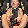 Lucas joined the competition — help win amazing prizes! baby, child, car_seat, harness, smiling, happy, infant, cute, skin, bare_chest, foot, hand, warning_label, black, seat, safety, indoor, closeup, person, young