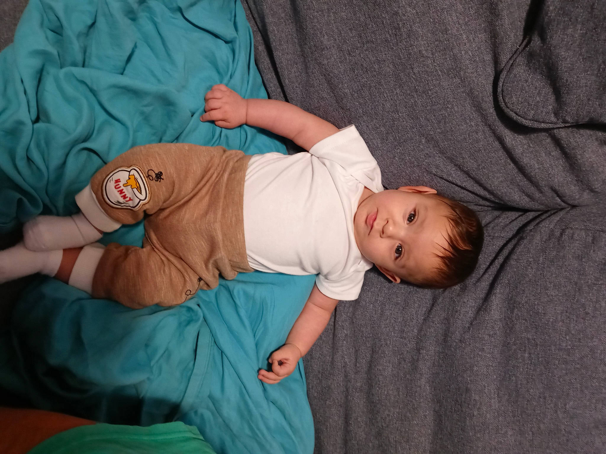 Rene is registered to the contest to win money with this photo: arm, baby, baby_products, baby_sleeping, baby_toddler_clothing, child, comfort, elbow, electric_blue, finger, hand, hat, joint, linens, pattern, person, room, sitting, sleeve, t_shirt