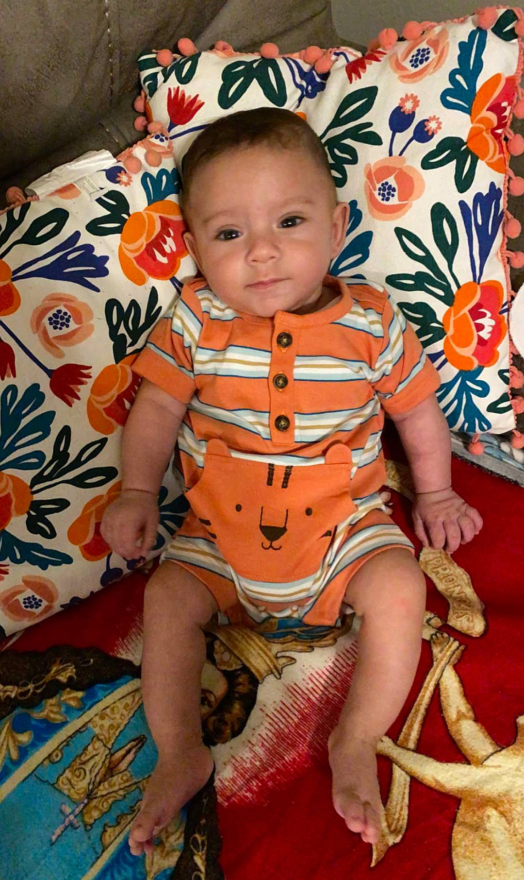 Rene joined the competition — help win amazing prizes! baby, baby_toddler_clothing, cheek, child, comfort, finger, foot, fun, happy, human_leg, orange, pattern, peach, person, pink, sitting, skin, textile, thigh, toddler