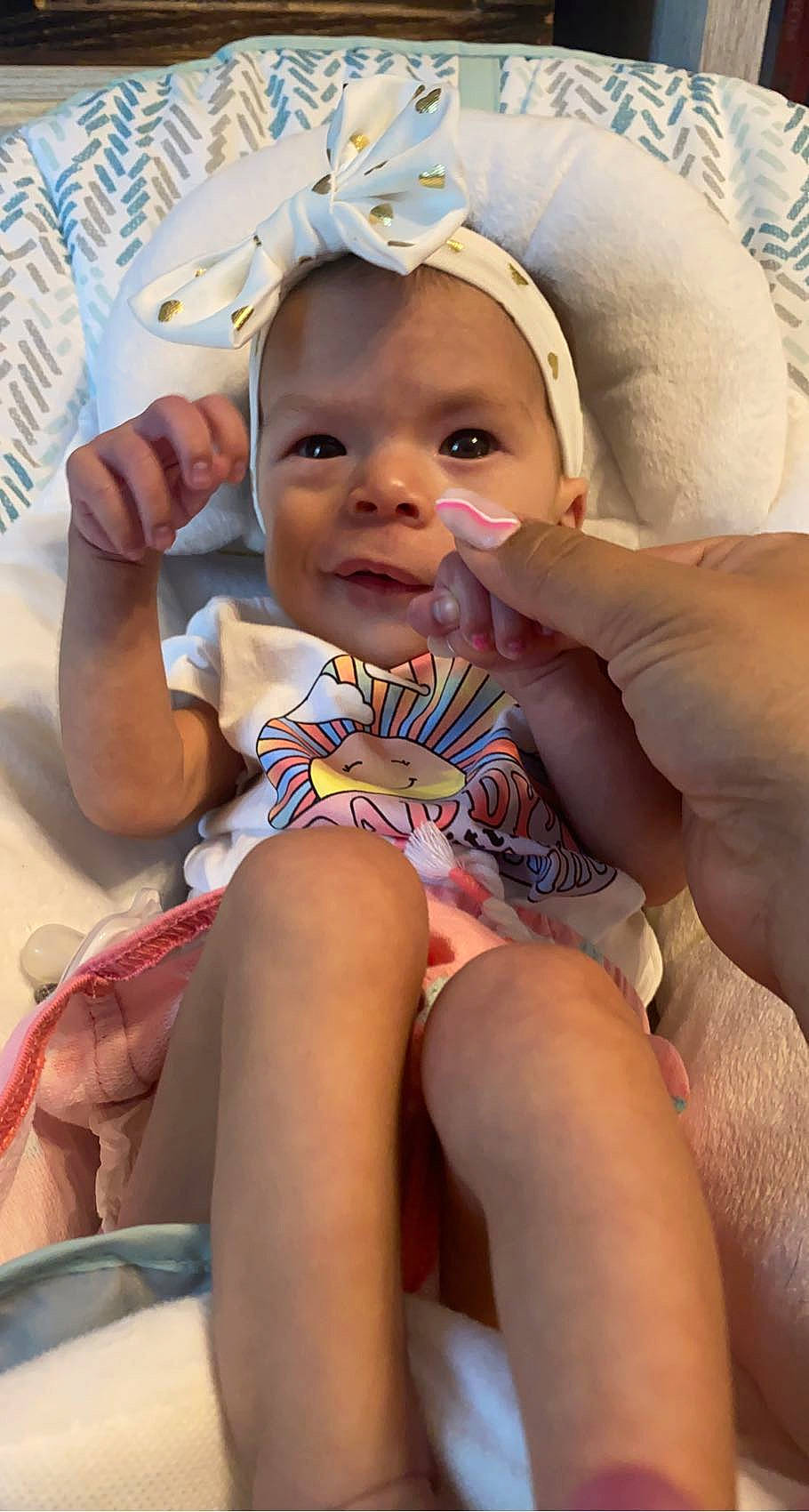 Athena joined the competition — help win amazing prizes! arm, baby, baby_toddler_clothing, cheek, comfort, eye, eyelash, finger, happy, hat, head, iris, mouth, nail, organ, person, skin, smile, thigh, thumb