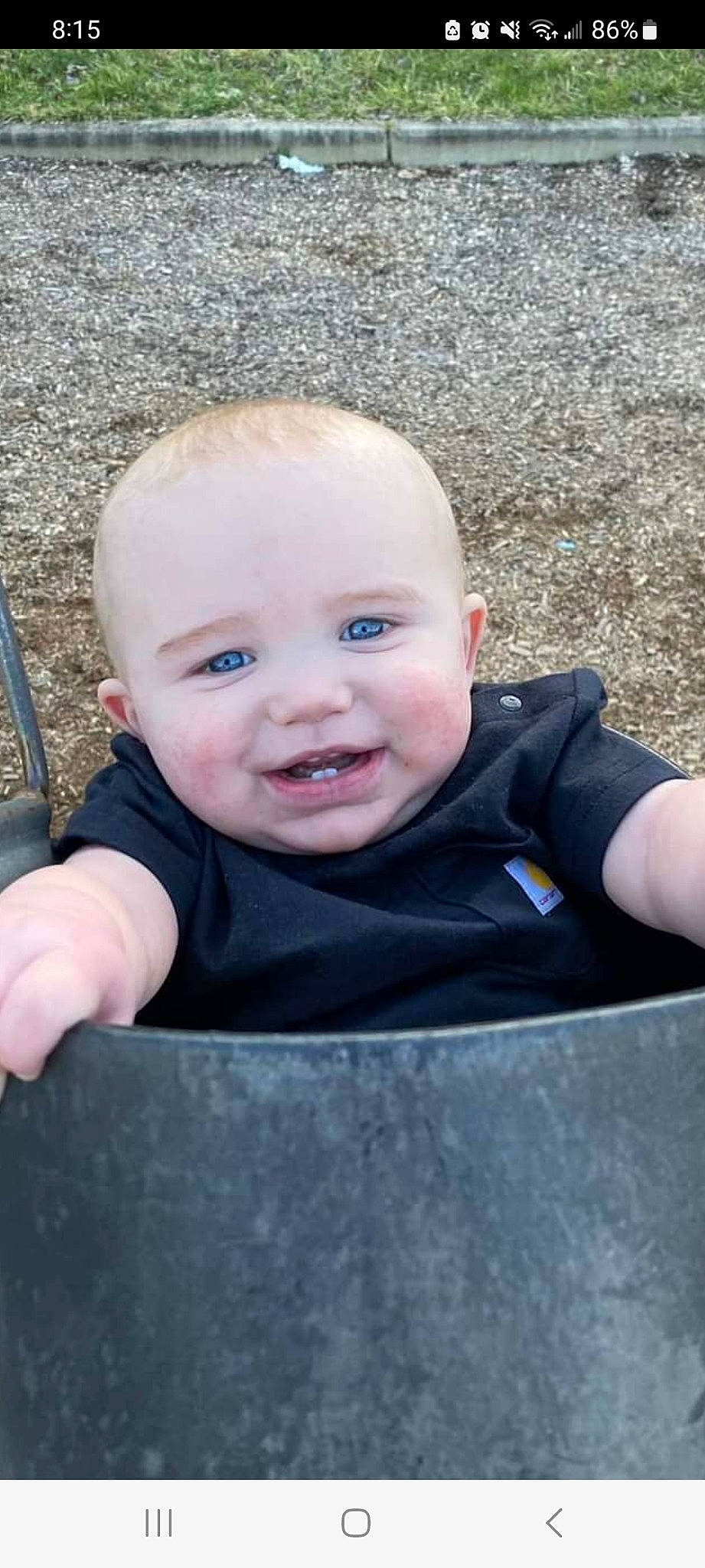 Hayes is registered to the contest to win money with this photo: cheek, chin, eye, eyebrow, facial_expression, flash_photography, grass, hairstyle, happy, head, human_body, iris, joy, lip, nose, person, plant, skin, sleeve, smile