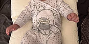 Ainsley is registered to the contest to win money with this photo: baby, infant, pillow, onesie, polka_dot, teddy_bear, cute, smiling, lying_down, soft_fabric, indoor, child, adorable, happy, comfortable, small_hands, bed, blanket, face, portrait