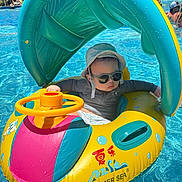 Tristan joined the competition — help win amazing prizes! child, toddler, sunglasses, sun_hat, inflatable_boat, pool, water, summer, outdoor, swimming, toy, yellow, blue, pink, plastic, fun, vacation, sunny, baby, cool