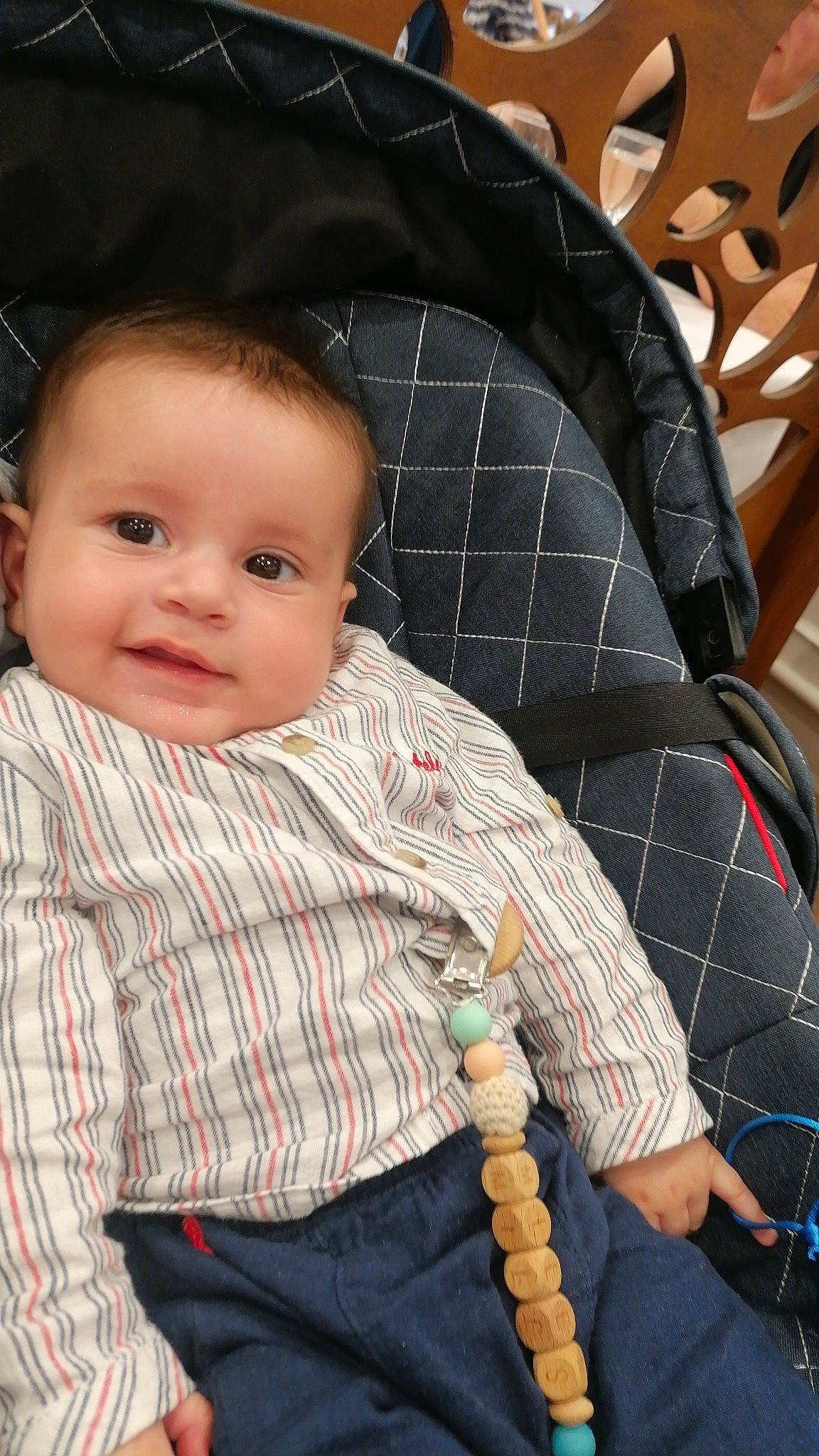 Miles participe au concours pour gagner de l'argent avec cette photo : baby, baby_products, baby_toddler_clothing, cheek, child, comfort, fashion_accessory, hairstyle, head, joy, lap, pattern, person, plaid, sitting, skin, sleeve, tartan, textile, toddler