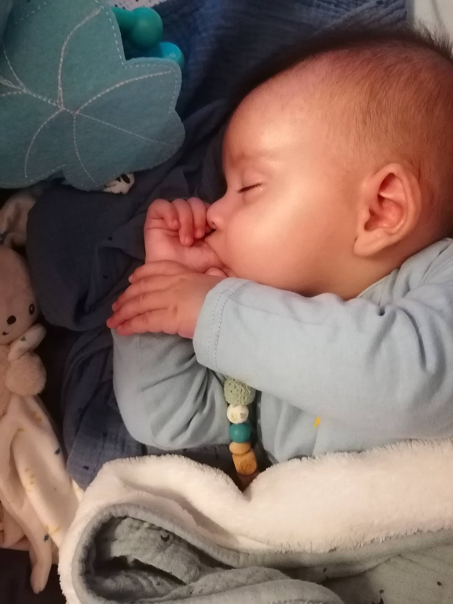 Miles participe au concours pour gagner de l'argent avec cette photo : baby, baby_products, baby_sleeping, baby_toddler_clothing, bedtime, cheek, child, comfort, finger, gesture, happy, lip, mouth, nose, person, product, sitting, skin, sleeve, thumb