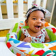 Journi is registered to the contest to win money with this photo: baby, babylaughing, bed, clothing, crib, cushion, face, furniture, happy, hat, head, homedecor, indoors, infantbed, laughing, person, photography, portrait, quilt, smile