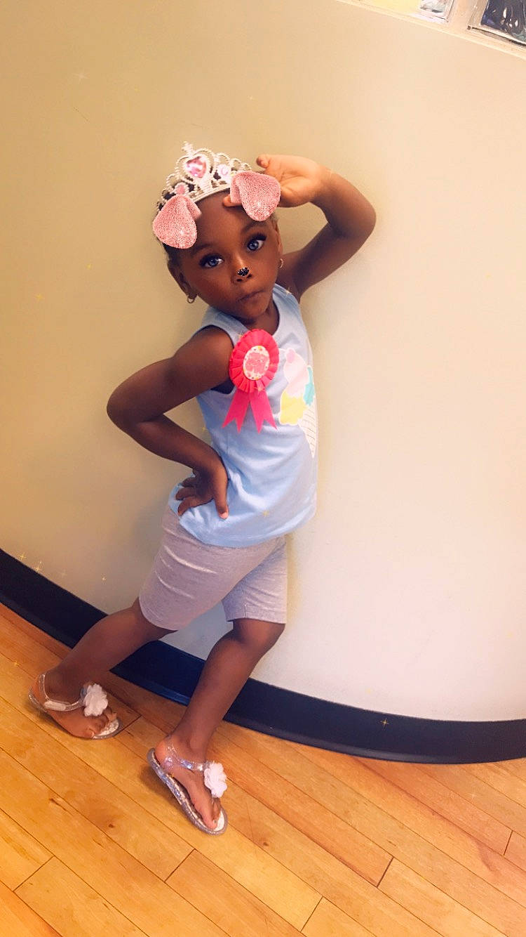 Kelani joined the competition — help win amazing prizes! baby, child, hair_accessory, headband, headwear, leg, person, pink, play, shoe, skin, standing, toddler