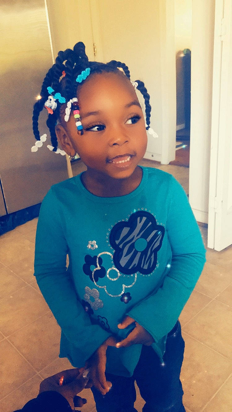 Kelani joined the competition — help win amazing prizes! afro, blue, child, cool, cornrows, ear, forehead, hair, hair_accessory, hairstyle, head, headband, person, smile, t_shirt, toddler, turquoise