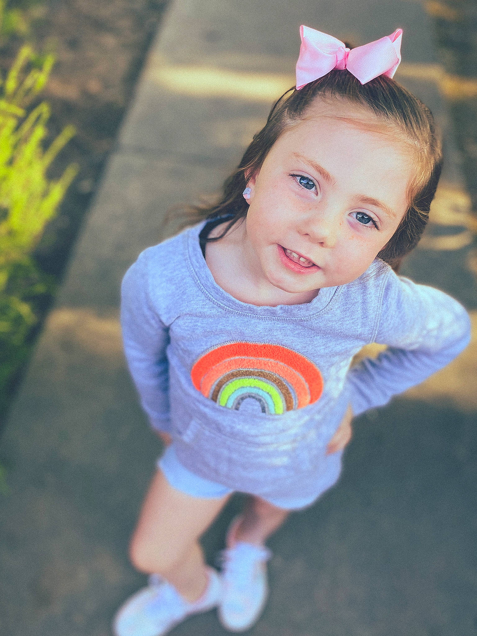 Paislee is registered to the contest to win money with this photo: baby_toddler_clothing, child, clothing, costume_hat, electric_blue, facial_expression, fun, grass, hair, happy, headband, headpiece, leisure, pattern, person, pink, sleeve, smile, t_shirt, toddler