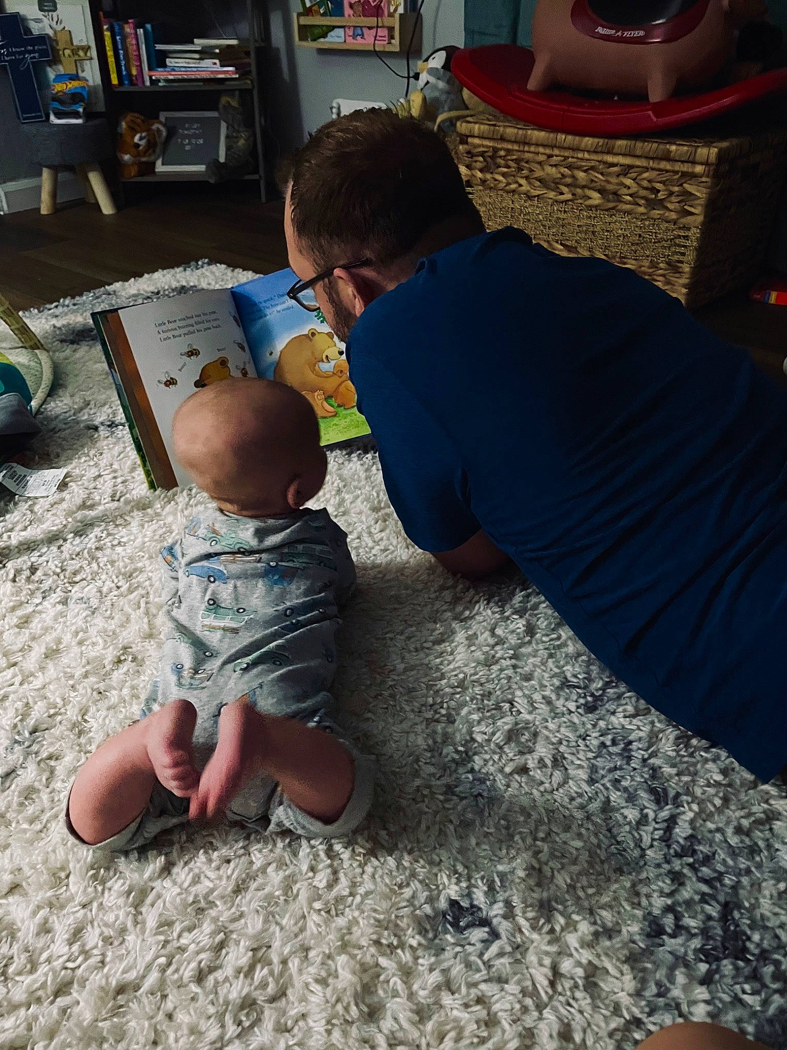 Riley joined the competition — help win amazing prizes! baby, baby_toddler_clothing, barefoot, bookcase, carpet, chair, child, comfort, flooring, foot, fun, human_leg, lap, leisure, person, play, room, shelf, sitting, t_shirt