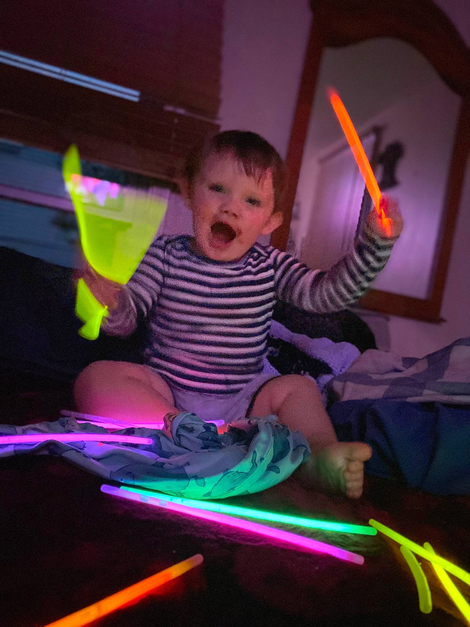Kain is registered to the contest to win money with this photo: baby, child, darkness, entertainment, event, fun, happy, leisure, magenta, neon, person, pink, purple, recreation, room, smile, space, t_shirt, toddler, violet