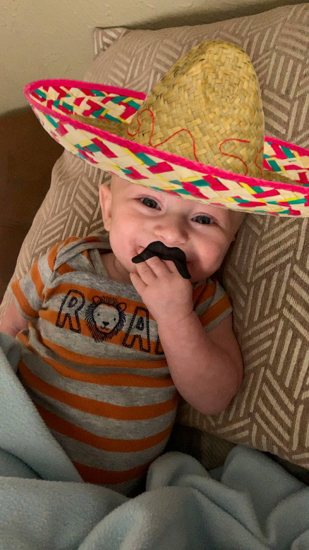 Jack is registered to the contest to win money with this photo: baby, child, clothing, costume_hat, cowboy_hat, dress, fedora, fun, glasses, grass, happy, hat, head, headgear, headwear, party_supply, person, smile, sombrero, sun_hat