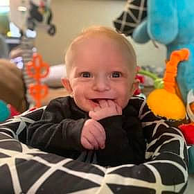 Jack is registered to the contest to win money with this photo: baby, baby_toddler_clothing, cheek, child, comfort, ear, eye, flooring, fun, hairstyle, happy, head, iris, joy, people, person, room, sitting, skin, smile