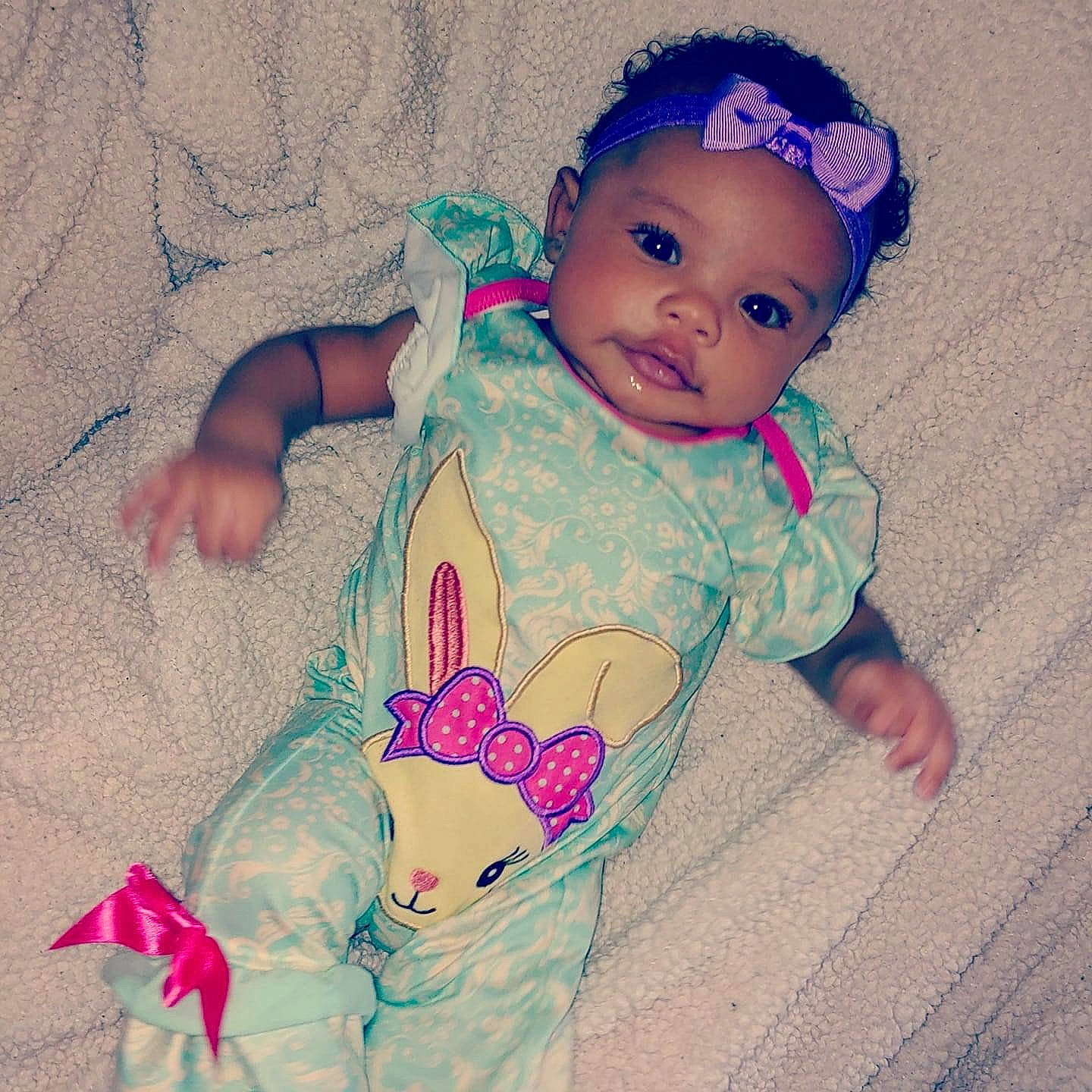 Kariah is registered to the contest to win money with this photo: baby, baby_products, baby_toddler_clothing, cheek, child, ear, face, hair_accessory, head, headband, headgear, headwear, lip, nose, person, pink, product, skin, toddler