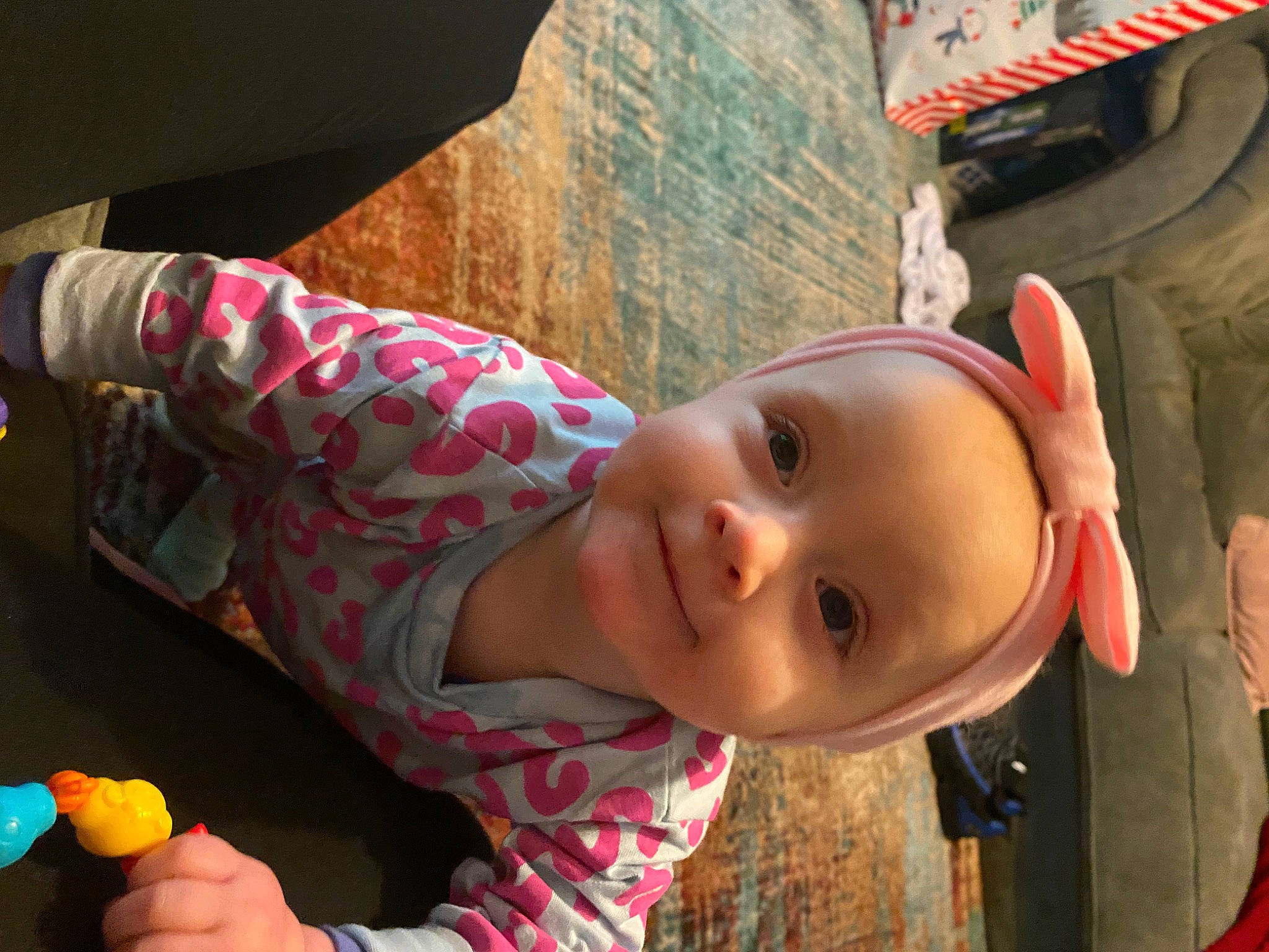 Ocean Rae is registered to the contest to win money with this photo: automotive_tire, baby, child, fun, happy, hat, joy, leisure, mouth, nose, person, play, room, sitting, smile, toddler, toy, vacation, wood