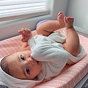 Ayla joined the competition — help win amazing prizes! baby, infant, towel, hooded_towel, changing_pad, pink, striped, window_blinds, natural_light, feet, cute, lying_down, indoors, child, skin, expression, face, hand, soft, cozy