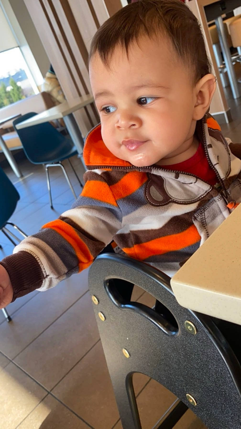 Kyrie joined the competition — help win amazing prizes! baby, baby_products, baby_toddler_clothing, carmine, chair, child, finger, flooring, fun, gadget, human_leg, machine, orange, person, personal_protective_equipment, sitting, sleeve, t_shirt, toddler, vehicle_door