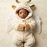 A'Mere is registered to the contest to win money with this photo: angel, baby, beige, child, costume, cute, expression, eyes, face, fluffy, fur, halo, indoors, infant, newborn, plush, portrait, wall, white, wings