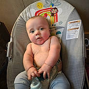 Ryan joined the competition — help win amazing prizes! baby, baby_chair, bottle, child, chubby, clothing, colorful, comfort, cute, face, happy, holding, indoor, infant, person, portrait, sitting, smiling, toy, young