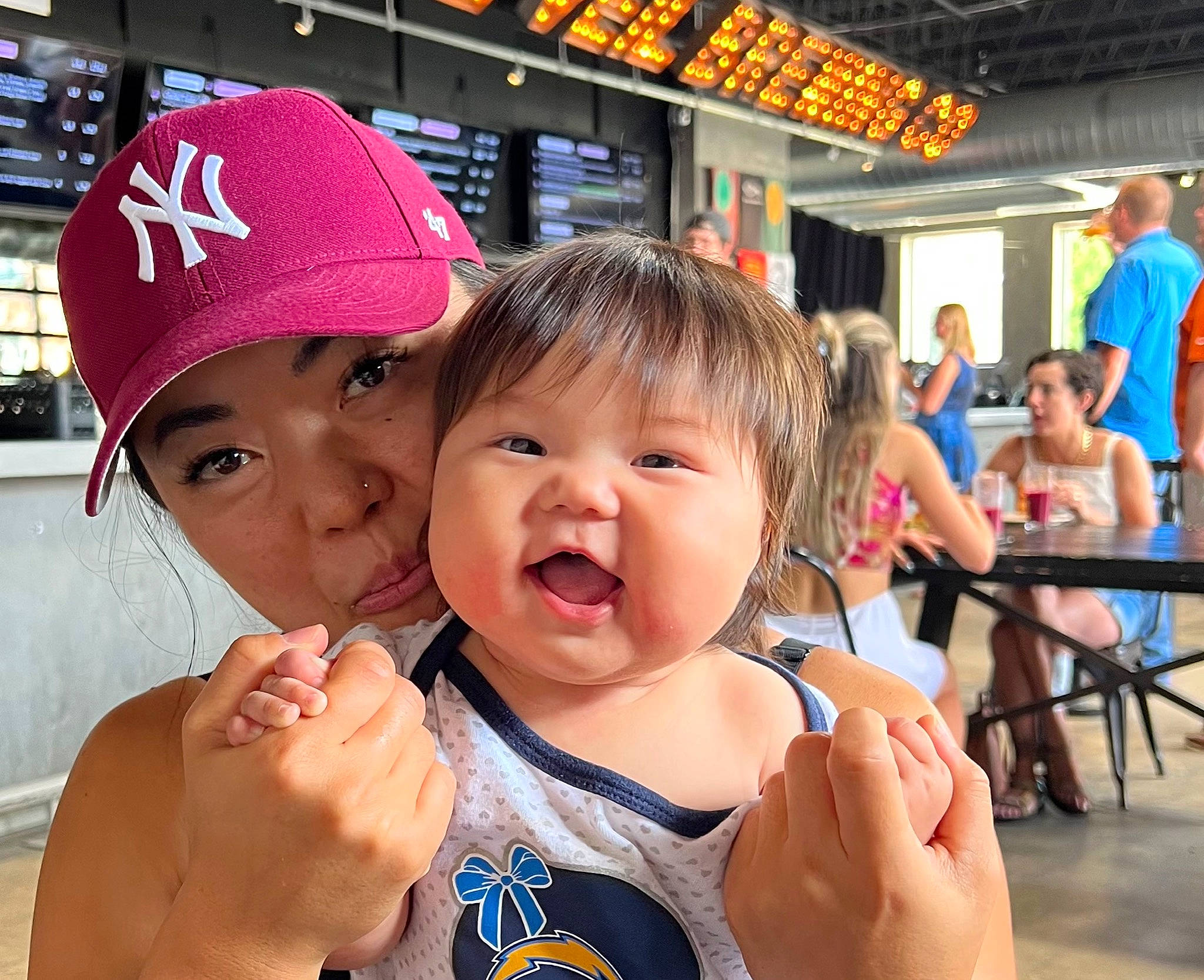 Momona is registered to the contest to win money with this photo: baseball_cap, cap, chair, child, event, fun, gesture, happy, hat, headwear, leisure, person, recreation, shorts, t_shirt, thumb, toddler, tourism, travel, vacation