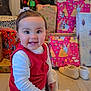 baby, child, christmas_tree, presents, gift_wrap, red_dress, white_tights, smiling, sitting, floor, holiday, indoors, festive, bow, cute, toys, shoes, happy, portrait, celebration