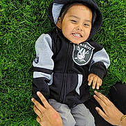 Cairo joined the competition — help win amazing prizes! black_clothing, casual_wear, child, daylight, fun, grass, gray_clothing, greenery, hand, happy, hoodie, outdoor, people, person, playing, portrait, relaxing, smiling, sneakers, young_child