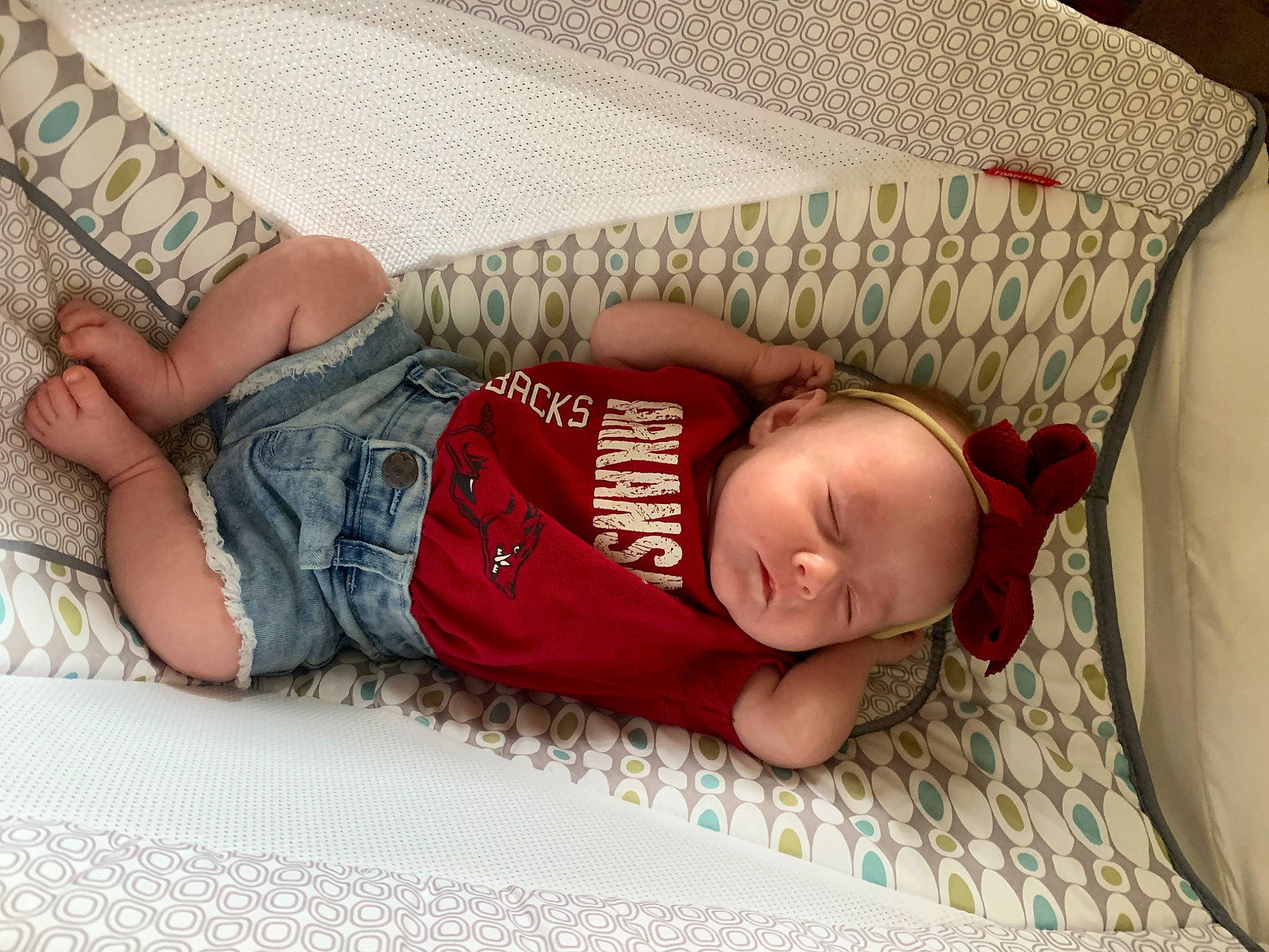 Cora joined the competition — help win amazing prizes! arm, baby, baby_sleeping, baby_toddler_clothing, bedtime, child, comfort, finger, flooring, foot, leg, linens, mouth, pattern, person, room, sitting, skin, thigh, toddler