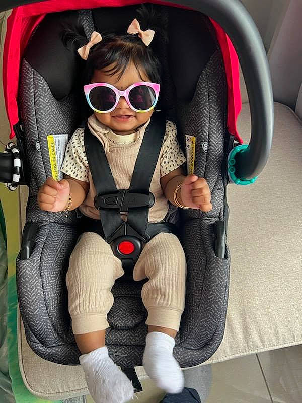 Davina joined the competition — help win amazing prizes! audio_equipment, auto_part, baby_products, car_seat, car_seat_cover, carmine, comfort, eyewear, fashion_accessory, glasses, goggles, head_restraint, person, personal_protective_equipment, product, seat_belt, sitting, steering_part, sunglasses, thigh