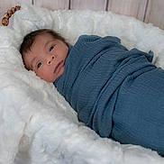 Lucifer joined the competition — help win amazing prizes! baby, basket, blue_blanket, child, cozy, cute, indoors, infant, newborn, peaceful, portrait, resting, sleepy, small, soft_texture, swaddled, warm, white_fur, wooden_background, wrapped