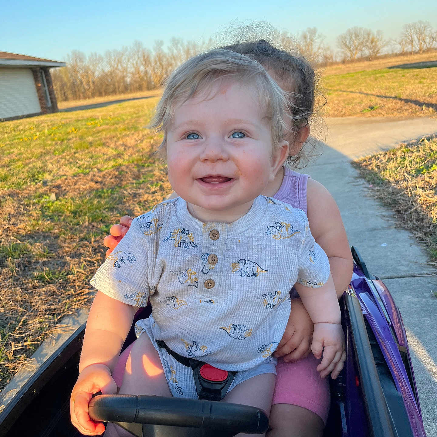 Daxton is registered to the contest to win money with this photo: architecture, baby, building, clothing, face, grass, head, nature, outdoors, park, person, photography, plant, playarea, portrait, shelter, sitting, summer, transportation, vehicle