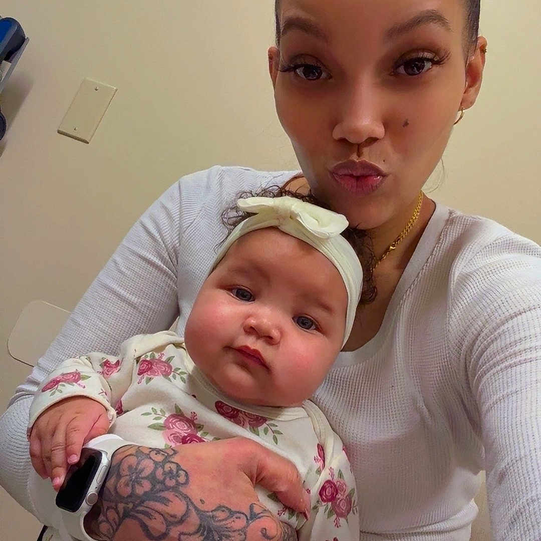 Tida is registered to the contest to win money with this photo: accessories, baby, bodypart, clothing, earring, face, finger, hair, head, jewelry, necklace, newborn, pants, people, person, photography, portrait, skin, t_shirt, tattoo