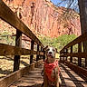Ao Ni joined the competition — help win amazing prizes! dog, bridge, wooden_bridge, harness, leash, outdoor, nature, rock_cliff, tree, sunlight, shadow, canyon, pet, animal, canine, sky, scenic, walk, park, adventure