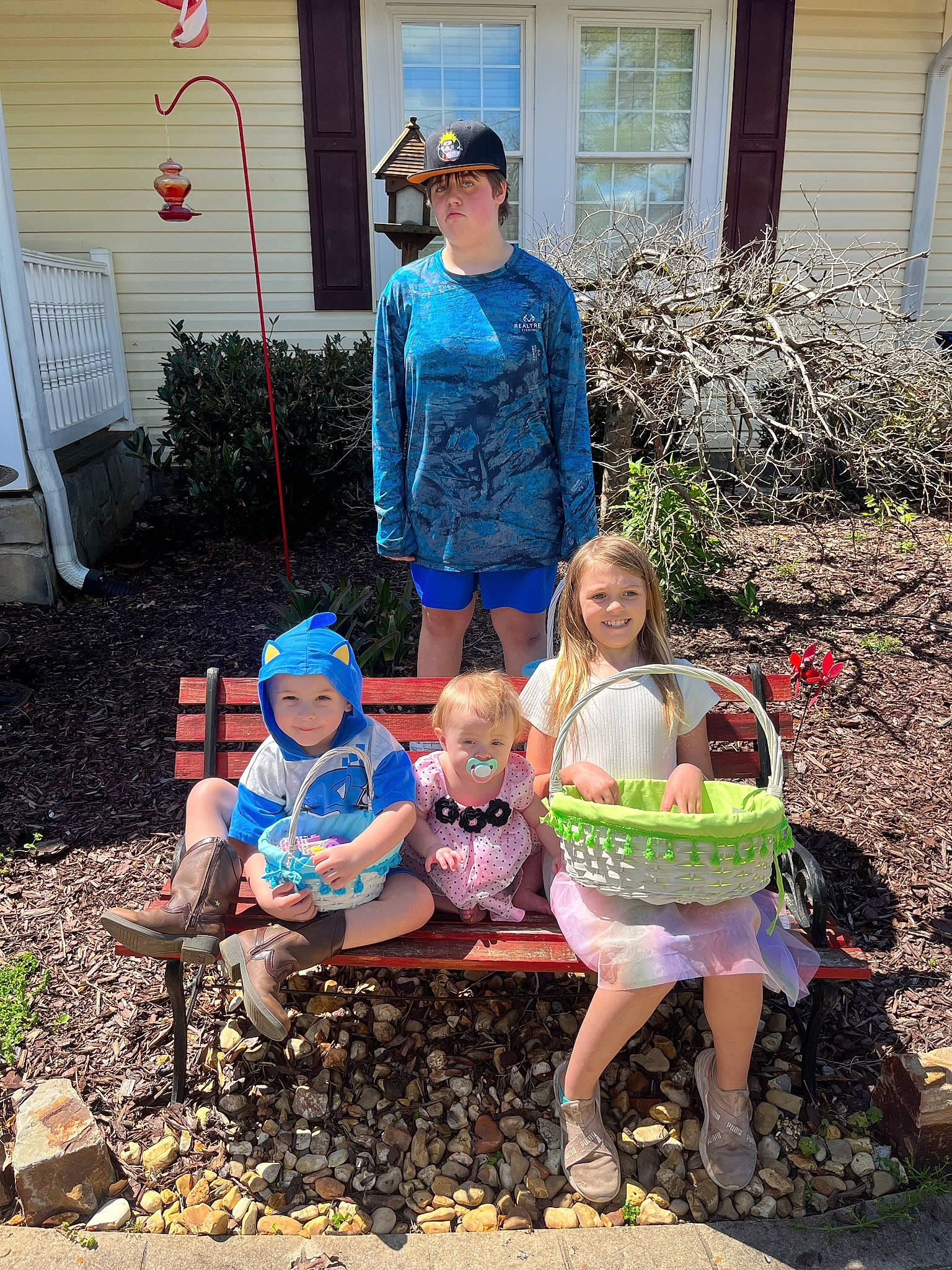Jayda is registered to the contest to win money with this photo: chair, child, door, event, fun, grass, happy, hat, headwear, joy, leg, leisure, outdoor_furniture, people_in_nature, person, plant, recreation, shoe, shorts, sitting