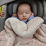 Madison is registered to the contest to win money with this photo: baby, infant, sleeping, blanket, car_seat, pacifier, face, hands, soft_texture, comfort, rest, child, cute, cozy, indoors, peaceful, wrapped, head, clothing, young