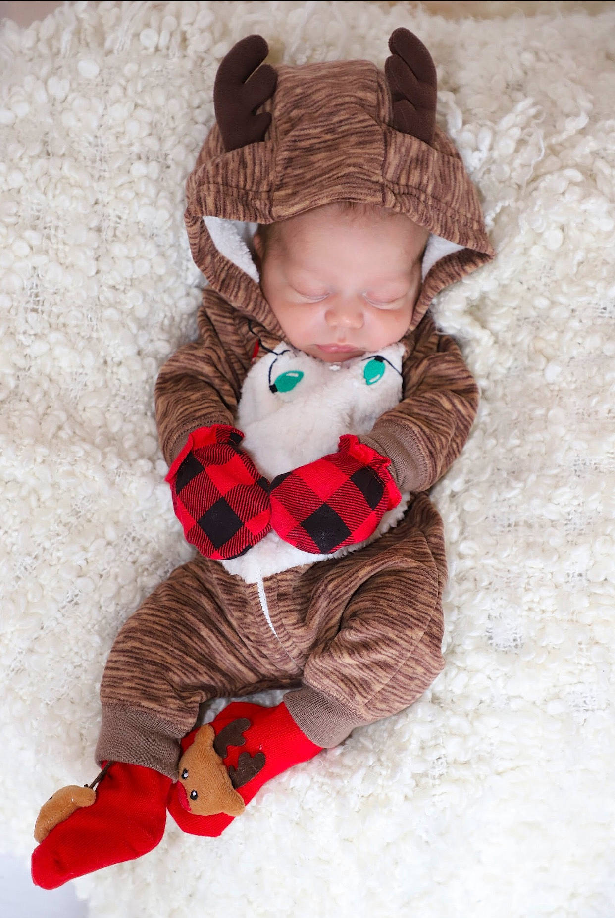 Elijah joined the competition — help win amazing prizes! baby, baby_toddler_clothing, beanie, bonnet, boot, child, costume_accessory, fur, hair_accessory, headband, headpiece, knit_cap, knitting, pattern, person, snow, sock, textile, winter, wool