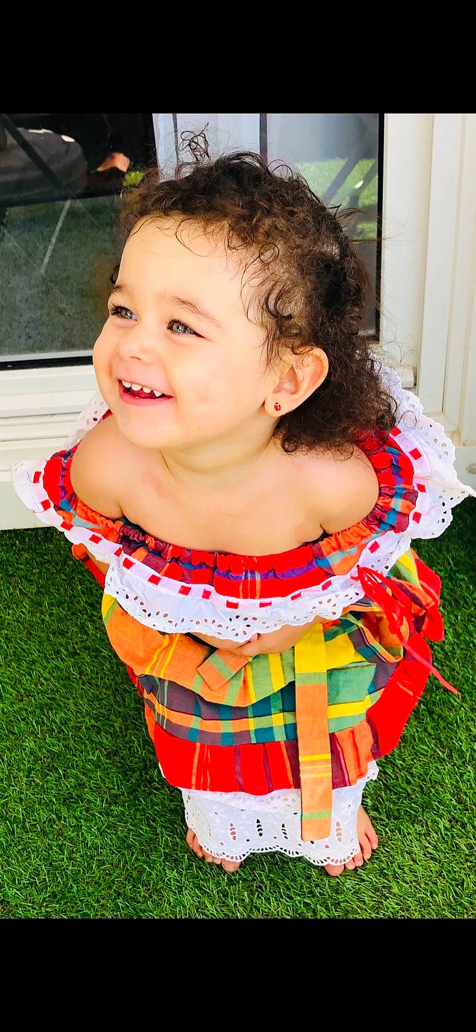 Giulya participe au concours pour gagner de l'argent avec cette photo : baby, baby_products, baby_toddler_clothing, cheek, child, curtain, day_dress, dress, face, fun, grass, happy, head, joy, leisure, pattern, person, sitting, skin, sleeve