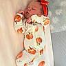 Maisie joined the competition — help win amazing prizes! newborn, baby, sleeping, infant, portrait, indoors, mattress, crib, pajamas, pumpkin_pattern, headband, bow, orange, pacifier, blanket, nursery, resting, peaceful, face, child