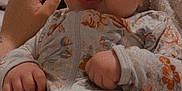 Kamiyah is registered to the contest to win money with this photo: baby, infant, smiling, face, hand, onesie, floral_pattern, clothing, blanket, cozy, cute, happy, tongue_out, person, soft_lighting, indoor, skin, nail_polish, comfort, relaxation