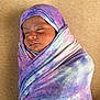 baby, blanket, blue, child, close_up, cozy, face, head, indoors, infant, newborn, peaceful, portrait, purple, resting, sleeping, soft, swaddled, tie_dye, wrapped