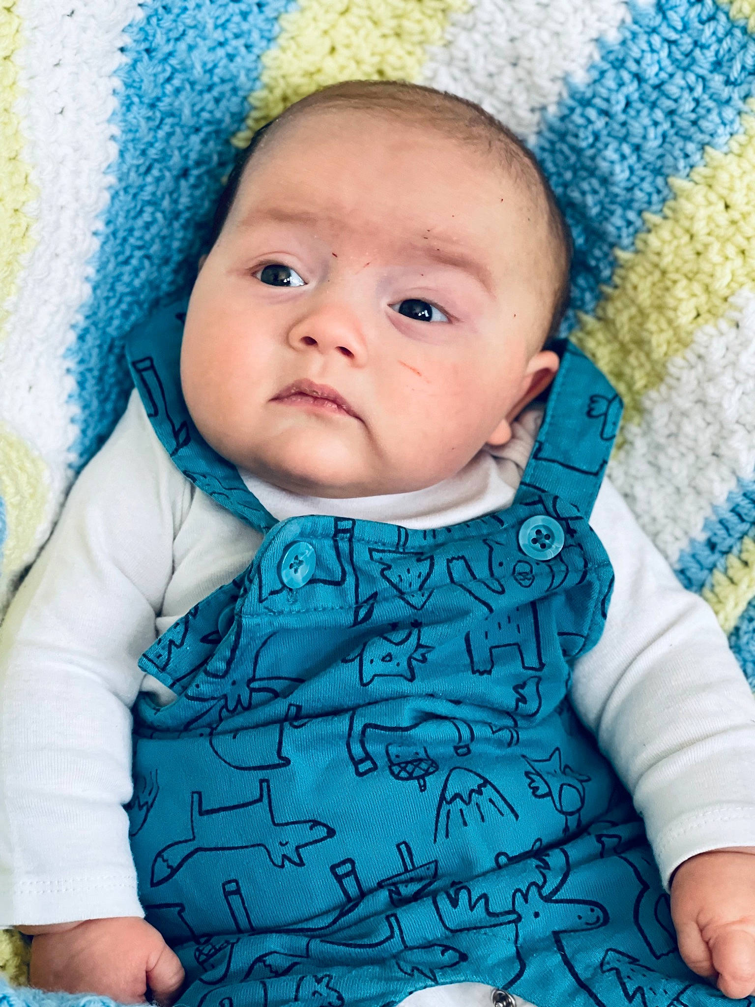 Caysen is registered to the contest to win money with this photo: aqua, azure, baby, baby_toddler_clothing, blue, cap, cheek, child, collar, electric_blue, face, headgear, knit_cap, linens, pattern, person, photograph, pink, skin, sleeve