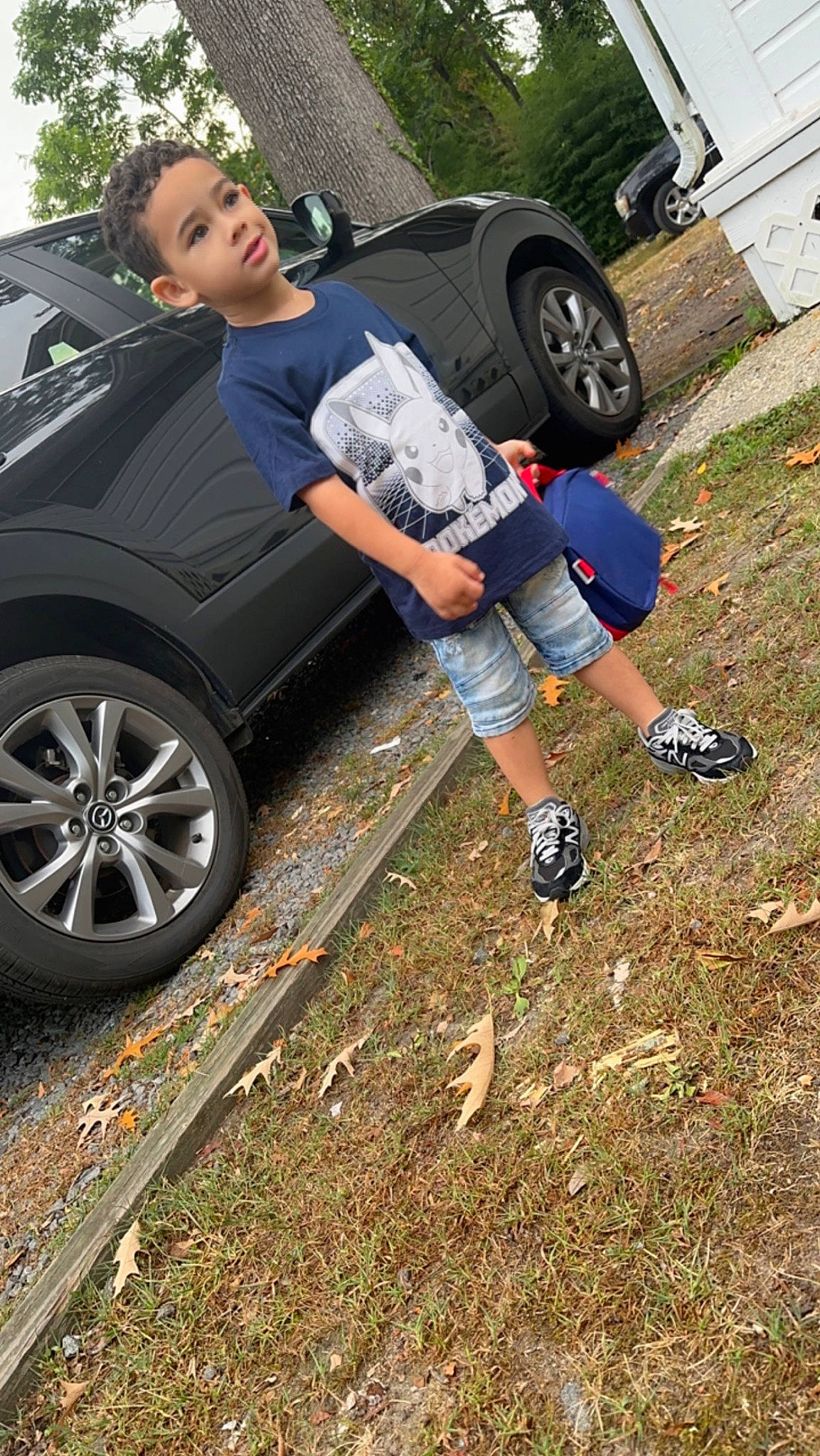 Gabriel is registered to the contest to win money with this photo: alloy_wheel, asphalt, automotive_design, automotive_exterior, automotive_lighting, automotive_tire, bumper, car, fender, hood, hubcap, motor_vehicle, person, rim, rolling, sneakers, tire, tread, vehicle, vehicle_door