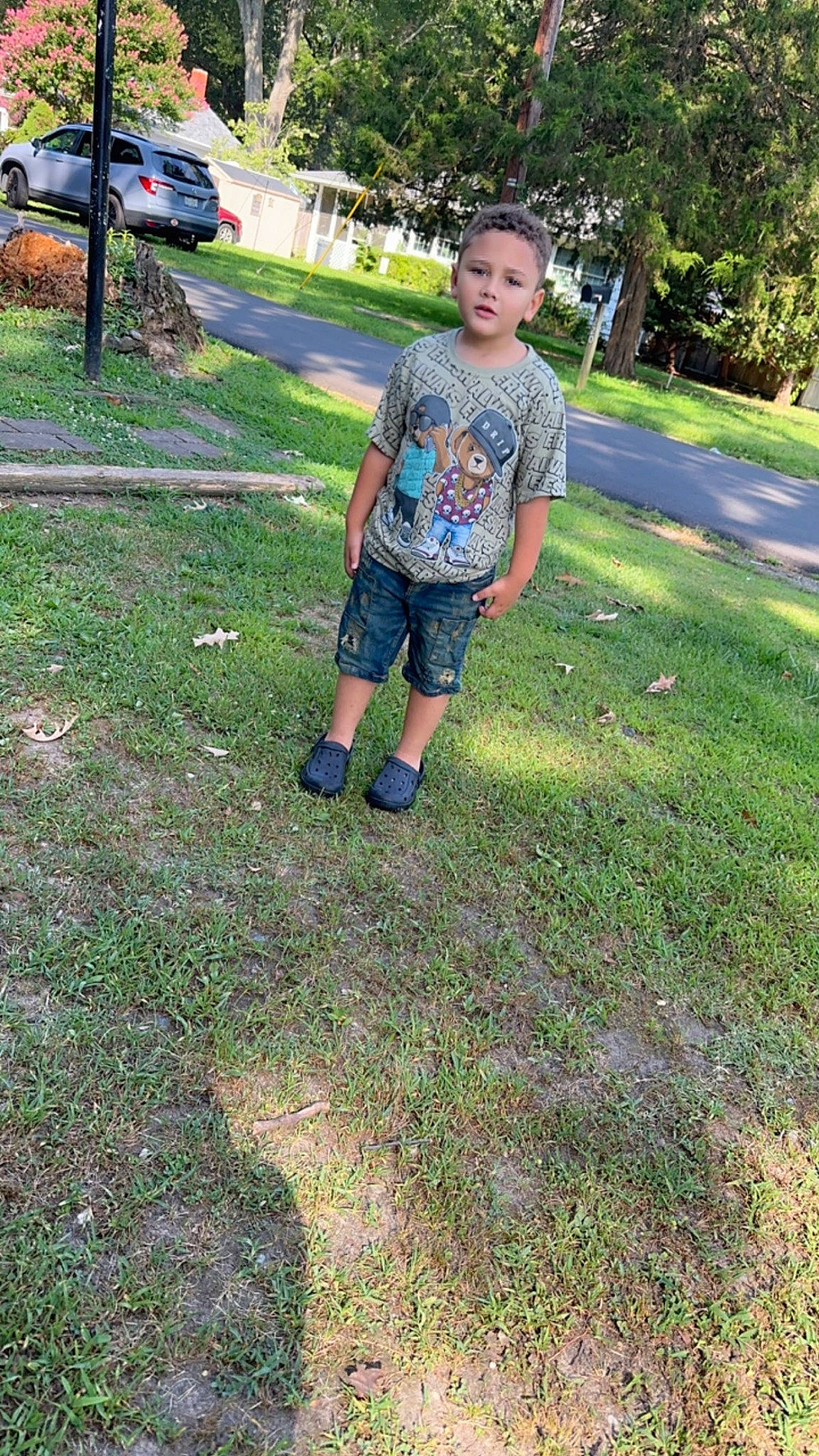 Christian joined the competition — help win amazing prizes! asphalt, car, child, grass, grassland, groundcover, landscape, lawn, leisure, people_in_nature, person, plant, recreation, shorts, shrub, t_shirt, tire, toddler, tree, vehicle