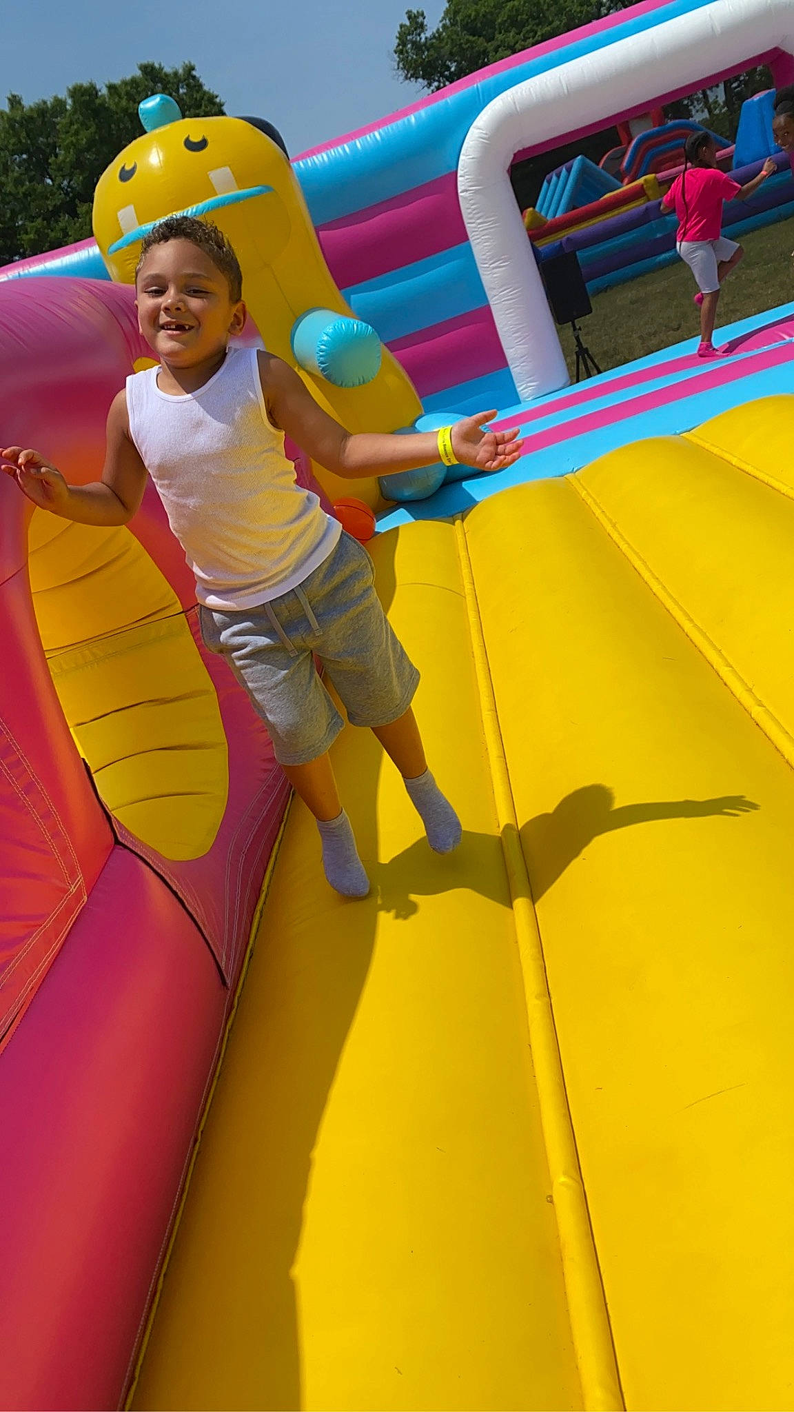Christian joined the competition — help win amazing prizes! bounce_house, child, chute, electric_blue, fun, happy, inflatable, joy, leisure, outdoor_play_equipment, outdoor_recreation, person, plant, play, playground, recreation, shorts, smile, toddler, tree